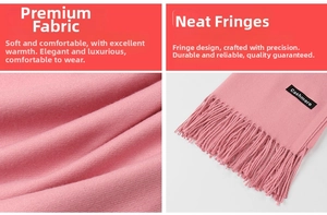 Close-up of soft pink cashmere scarf showing fine texture and long fringe tassels