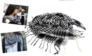 Close-up of black and white checkered tactical shemagh with fringe and tassels detail