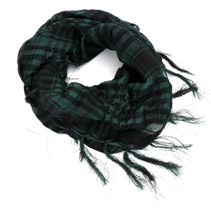Detail of army green and black tactical scarf featuring classic keffiyeh plaid and long fringes