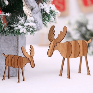 Set of two handcrafted wooden Christmas reindeer ornaments for rustic holiday table decor