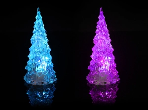 Close-up of blue and purple glowing LED crystal Christmas tree lights with mirror reflection