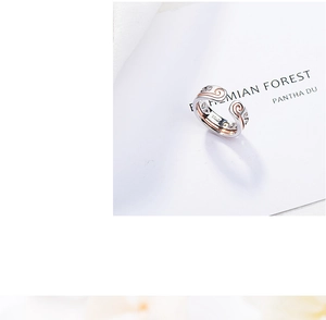Detailed close-up of S925 sterling silver ring featuring golden wave patterns