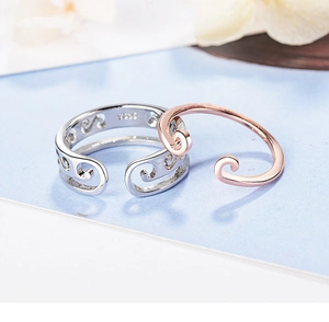 Detailed view of silver S925 engraved ring and rose gold band in adjustable open style