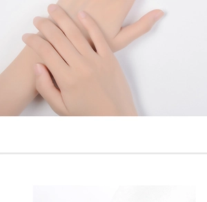 Close-up of hands showing ring wearing style for minimalist lovers on white backdrop