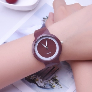 Minimalist silicone jelly watch for women in dusty rose color worn on wrist