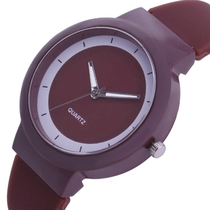 Close-up of minimalist dark red silicone quartz watch with white markers and silver hands