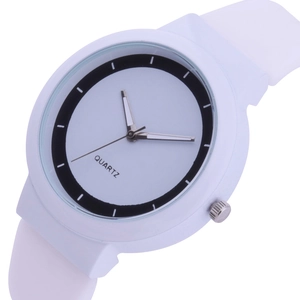Detailed close-up of a minimalist quartz watch dial with black ring design and white silicone strap