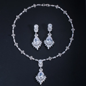 Detail of bridal jewelry set with teardrop zircon necklace and matching earrings