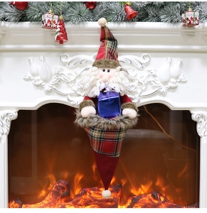 Detailed view of Santa hanging gift bag featuring plaid fabric and plush textures