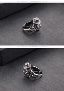 Detail view of retro punk clown ring featuring skull carvings and matte titanium steel finish
