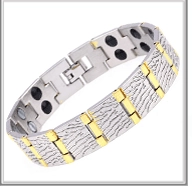 Macro view of men's bicolor steel bracelet with magnetic therapy stones and folding clasp