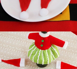 Detailed view of Christmas bottle covers and mini Santa hats for holiday table decor