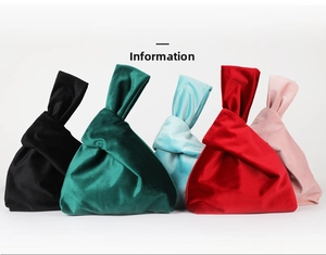 Detail of velvet wrist bags in multiple colors showing soft texture and knot closure