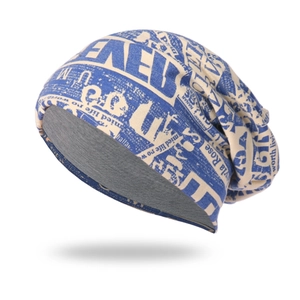 Knitted slouchy beanie with vintage newspaper print and warm gray inner lining
