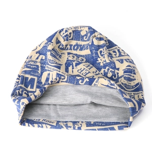 Beige slouchy beanie with blue newspaper print and soft grey lining for men and women
