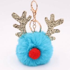 Detailed view of reindeer keychain with blue pompom and golden glitter antlers