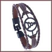 Close-up of leather bracelet with black alloy buckle and circular rail pattern detail