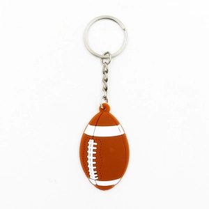 Close-up of American football keychain with realistic brown texture and silver chain