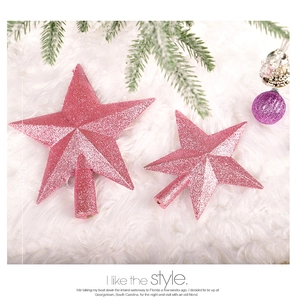 Detail of pink glitter Christmas tree topper star with secure hollow base attachment