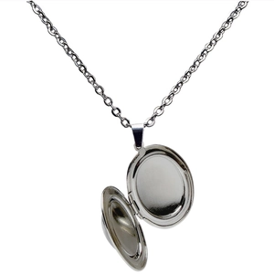 Macro view of open oval silver locket pendant on stainless steel O-chain