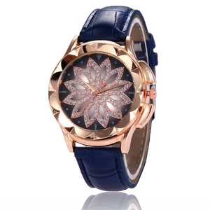 Elegant women's watch with rose gold flower case, diamond lotus dial, and navy leather strap