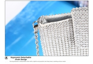 Close-up of silver rhinestone evening bag showing detachable chain and secure metal hook