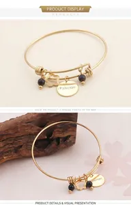 Detail of adjustable gold bracelet with heart charm and 'i ❤ you mom' engraved pendant