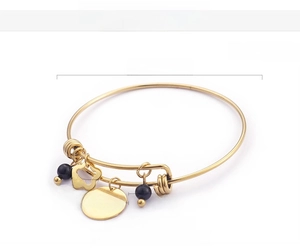 Detailed view of the 'I love you mom' engraved charm on a gold-plated adjustable bangle