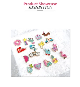 Flat lay collection of various colorful enamel pins featuring cute cartoon food and animal icons