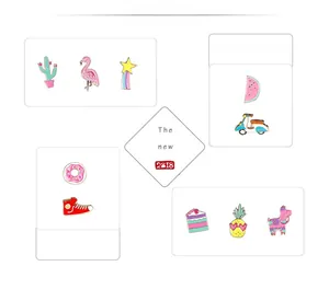 Detailed collection of cartoon enamel pins including flamingo cactus and rainbow star badges