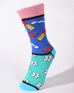 Detail of pop art cotton socks featuring blue body, red lips and daisy flower patterns