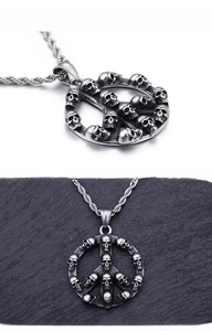 Detail of punk style skull peace sign pendant with vintage silver finish on rope chain