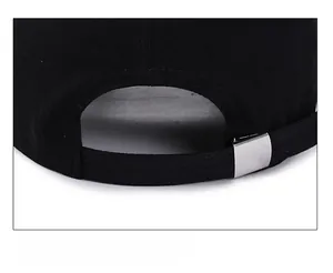 Detail of black baseball cap showing adjustable strap with silver metal slide buckle