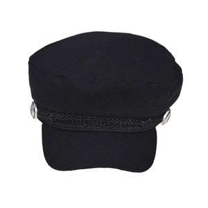 Detail of black wool newsboy cap with braided rope trim and silver buttons