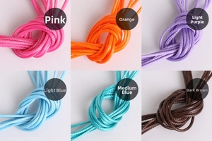 Detailed grid view of 2mm braided wax cords in peach, orange, purple, and blue colors