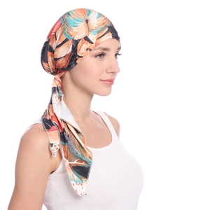 Detail of the tropical floral print on the adjustable women's headscarf with vibrant colors