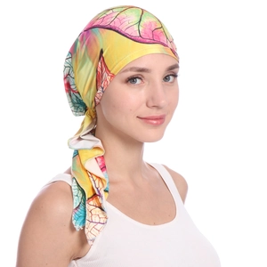 Detail of colorful leaf pattern on vibrant floral turban headwrap for women