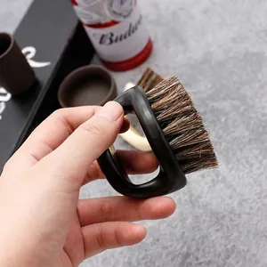 Mens beard cleaning brush with ergonomic black D-ring handle and natural boar bristles