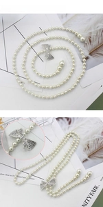 Collier élégant en perles blanches synthétiques avec nœud strass brillant pour femme