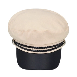 Close-up of a beige baker boy hat featuring a black brim and braided rope detail