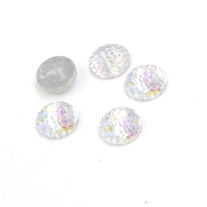 Detail shot of 14mm round resin cabochons with iridescent fish scale texture and flat back