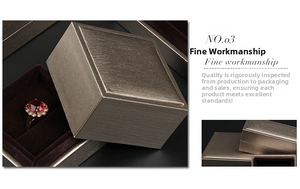 Macro shot of metallic brushed champagne gold jewelry boxes with velvet lining