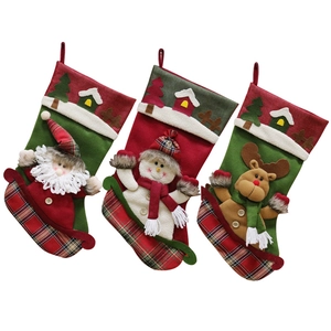 Set of 3 Christmas stockings featuring Santa, snowman, and reindeer hanging decorations