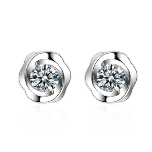 Sparkling silver camellia flower stud earrings with brilliant zircon stones on white background