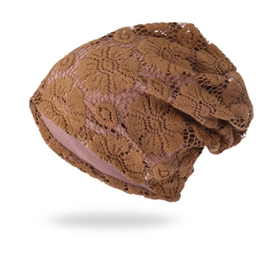 Close-up of brown floral lace slouchy beanie featuring hollow-out embroidery and soft lining