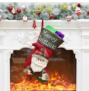 Detail of red Christmas stocking with 3D Santa Claus and gifts by a fireplace