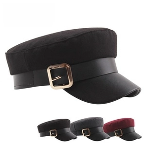 Detail of wool blend captain hats in black, grey, and red with leather strap and gold buckle