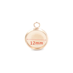 Close-up of 12mm round rose gold stainless steel pendant base for DIY jewelry