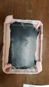 Detail view of pink fabric edge frame with model number 602 on black inner base