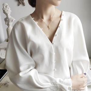 Close-up of rose flower pendant necklace in 925 sterling silver with elegant gold finish
